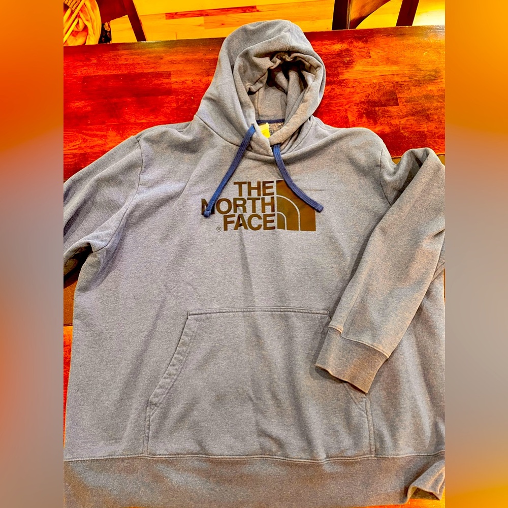 Blue men’s North Face sweatshirt